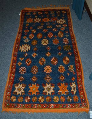 Lot 1345 - Rabat rug, North Africa, the mid indigo field of stepped medallions and stellar motifs enclosed...