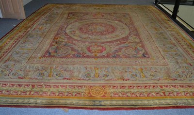 Lot 1346 - Large 19th century Savonnerie carpet, probably Central France, the soft salmon pink field...