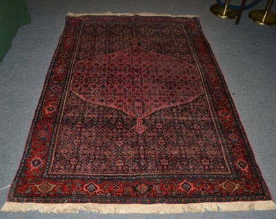 Lot 1347 - Bidjar rug, Iranian Kurdistan, the indigo Herati field centred by a coral pink serrated anchor...