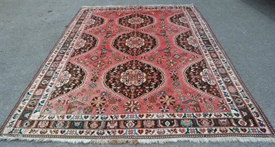 Lot 1357 - Kashgai carpet, South West Iran, the faded candy pink field with three cusped oval medallions...