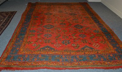 Lot 1359 - An early 20th century Ushak carpet, Central West Anatolia, the terracotta field with an allover...