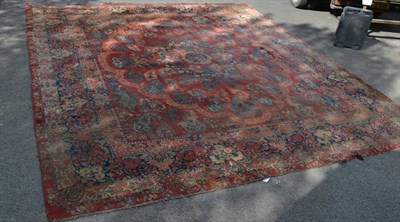 Lot 1361 - A Saroukh carpet of unusual size, West Iran, the abrashed strawberry field of floral sprays centred