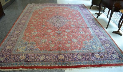 Lot 1365 - Kashan carpet, Central Iran, the crimson field of vines around a pole medallion framed by spandrels