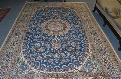 Lot 1370 - Nain carpet, Central Iran, the mid indigo field of scrolling vines around a flowerhead...