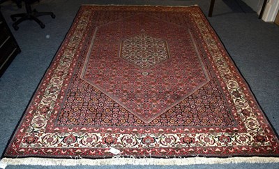 Lot 1376 - A Bidjar carpet, Iranian Kurdistan, the rose Herati field with ivory central lozenge framed by...