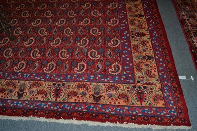 Lot 1377 - Khorasan Carpet, East Iran, the blood red field with an allover design of boteh enclosed by...