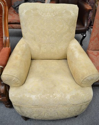 Lot 1380 - A low armchair with cream fabric, 80cm wide