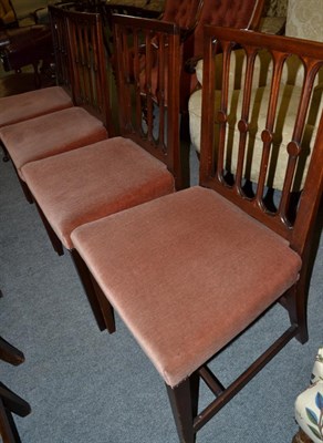 Lot 1383 - A set of four early 19th century mahogany dining chairs, pierced backs, overstuffed seats,...