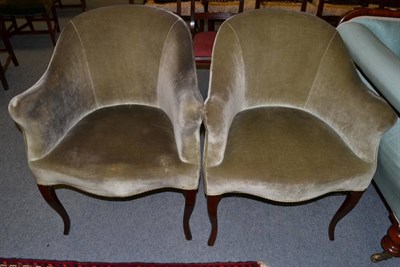 Lot 1389 - A pair of Victorian tub shaped chairs upholstered in green velvet, 66cm wide