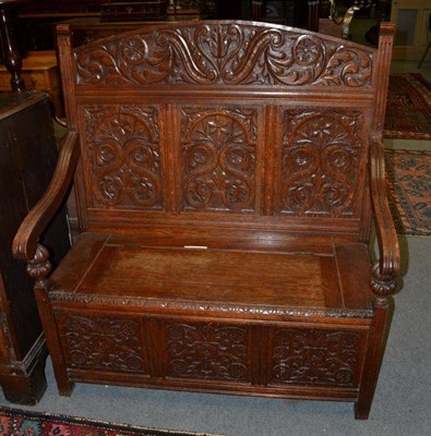 Lot 1397 - A late Victorian carved oak hall settle, 106cm wide