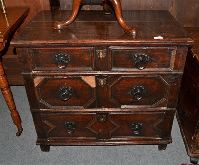 Lot 1404 - {} A 17th century oak chest of small proportions with three geometric moulded drawers, 80cm wide