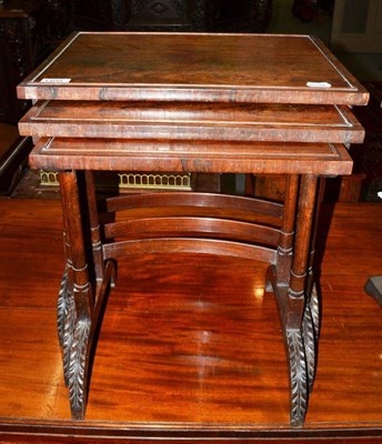 Lot 1409 - A nest of Regency rosewood tables of small proportions, the largest 45cm wide