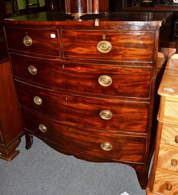 Lot 1415 - A Regency mahogany bow fronted five drawer chest, of two short over three long drawers, raised...