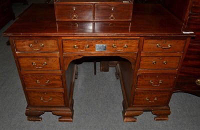 Lot 1417 - A mahogany knee hole desk with presentation plaque dated 14 December 1922, 114cm wide