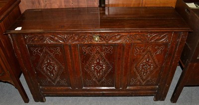 Lot 1420 - {} A joined oak chest with hinged lid above lozenge carved panels (part 17th century), 118cm wide