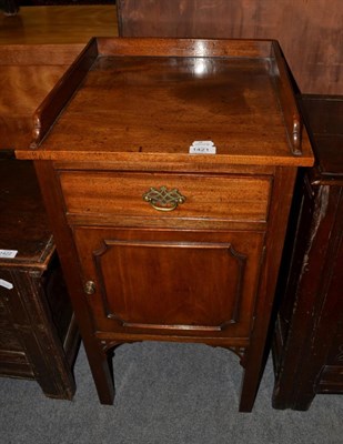 Lot 1421 - {} A mahogany bed side cupboard with a gallery top, 44cm wide