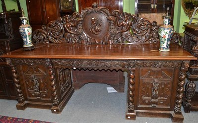 Lot 1430 - An impressive Victorian carved oak sideboard with carved gallery and two cupboard doors, 271cm wide