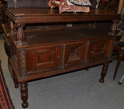 Lot 1439 - A carved oak buffet with two cupboard doors initialled 'WGE' and dated 1629, raised on turned legs