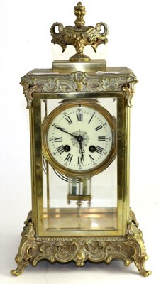 Lot 1463 - A gilt metal four glass striking mantel clock, circa 1900, urn finial and scroll borders,...