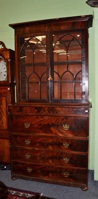 Lot 1468 - A mahogany rosewood secretaire bookcase, upper section with glazed Gothic style doors enclosing...