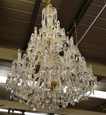 Lot 1486 - An impressive twenty four branch cut glass chandelier, graduated form, maximum drop...