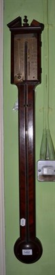 Lot 1492 - A mahogany stick barometer, signed Manticha & Co, circa 1820, broken arched pediment, exposed...