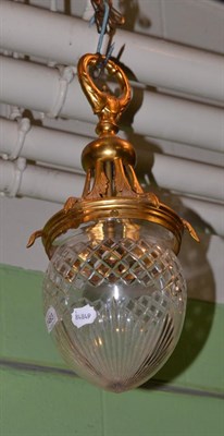 Lot 1493 - A cut glass and gilt pendant light fitting, drop approximately 50cm