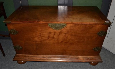 Lot 1502 - A 20th century blanket chest raised on bun feet