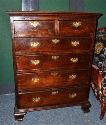 Lot 1503 - An 18th century oak six drawer straight front chest, the moulded top above two short and four...