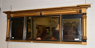 Lot 1504 - ^ A Regency gilt painted over mantle mirror, 160cm wide