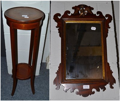 Lot 1515 - {} An Edwardian mahogany plant stand, 97cm and a George II style fret cut wall mirror, 61cm