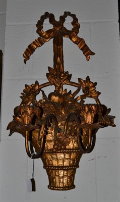 Lot 1518 - A 19th century gilt wooden wall sconce in the form of a flower basket with two branches, once...