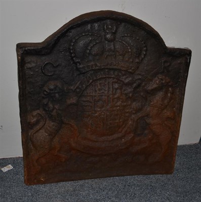 Lot 1525 - A Charles II cast iron fire back, 59cm high