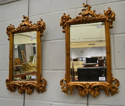 Lot 1533 - A pair of gilt bevelled glass mirrors of recent date, 60cm high