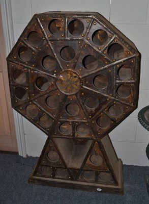 Lot 1534 - {} An Indian hardwood and metal bound wine rack, 78cm wide