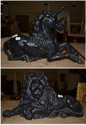 Lot 1537 - {} A pair of fireside halve ornaments modelled as a unicorn and lion, 62cm wide