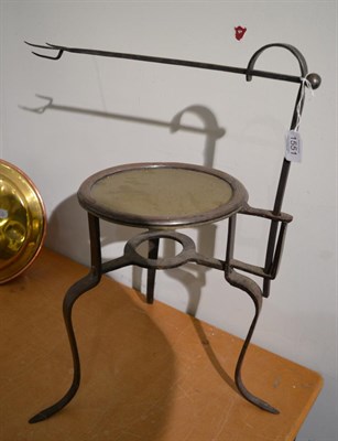 Lot 1551 - An 18th century steel spit on stand, 53cm high