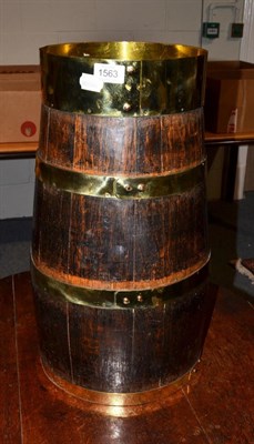 Lot 1563 - A wood and brass barrel of staved construction, 54cm high