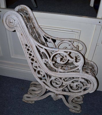 Lot 1572 - A Victorian white painted cast iron bench, lacking slats, height 87cm