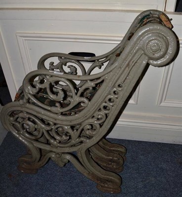 Lot 1573 - A Victorian green painted cast iron bench, lacking slats, height 84cm