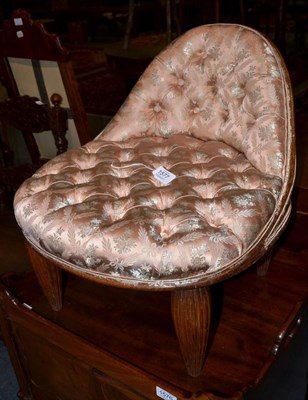 Lot 1577 - A 19th century mahogany small stool with reeded legs, recovered in pink button fabric, 44cm wide