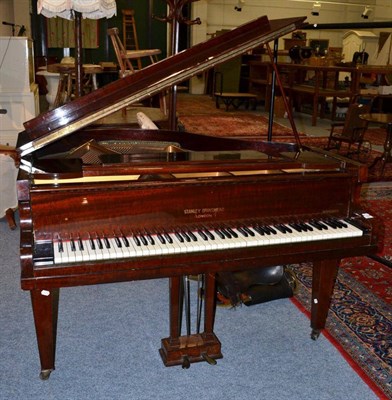 Lot 1581 - A 4ft 2in baby grand piano labelled 'Stanley Brinsmead' raised on square tapering legs