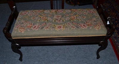 Lot 1582 - An Edwardian mahogany duet stool with needlework seat, 97cm wide