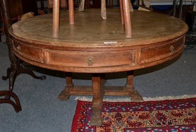 Lot 1586 - A late 19th century oak circular drum table, 138cm diameter