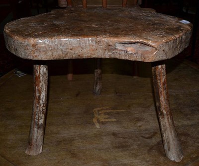 Lot 1588 - A primitive Welsh triform 19th century table formed from a section of a tree retaining much of...