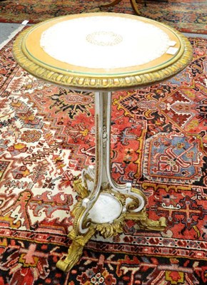 Lot 1590 - A cream and gilt tripod table, 76cm high by 46cm wide