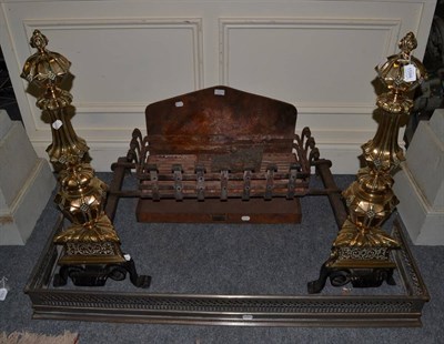 Lot 1594 - An impressive brass and cast iron fire insert a pair of fire dogs and another fire grate, 89cm wide