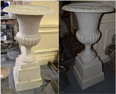 Lot 1595 - A pair of large white campana urns, on plinth bases, 110cm high