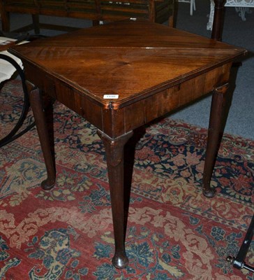 Lot 1598 - # A George II mahogany triangular tea or games table, circa 1750, the hinged leaf with...