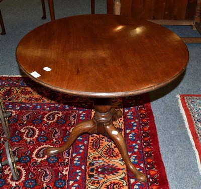 Lot 1607 - A George III mahogany and birdcage platform tripod table, circa 1780, the one piece top raised on a